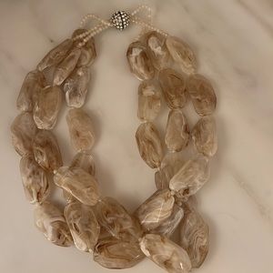 Triple layered necklace with jeweled clasp